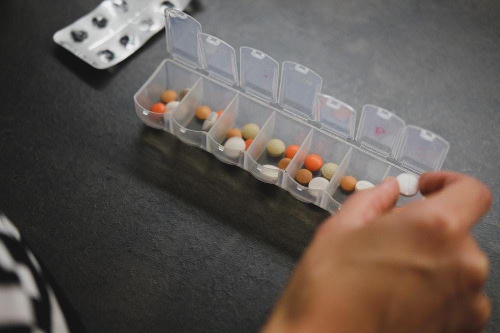 A pill box with multiple different supplements
